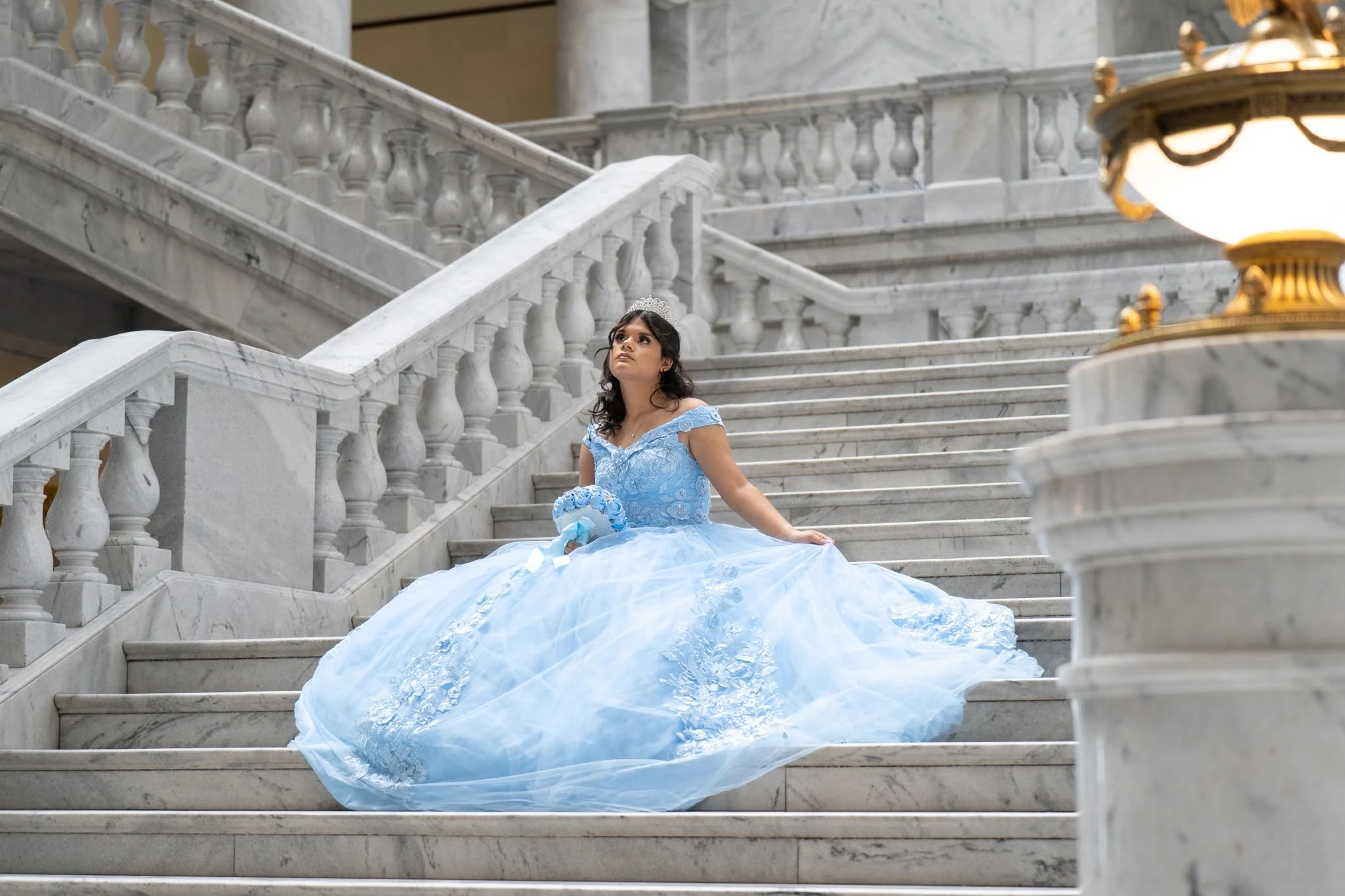 Quinceañera portrait in a blue gown
